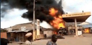 Petrol attendants extinguish burning minibus
